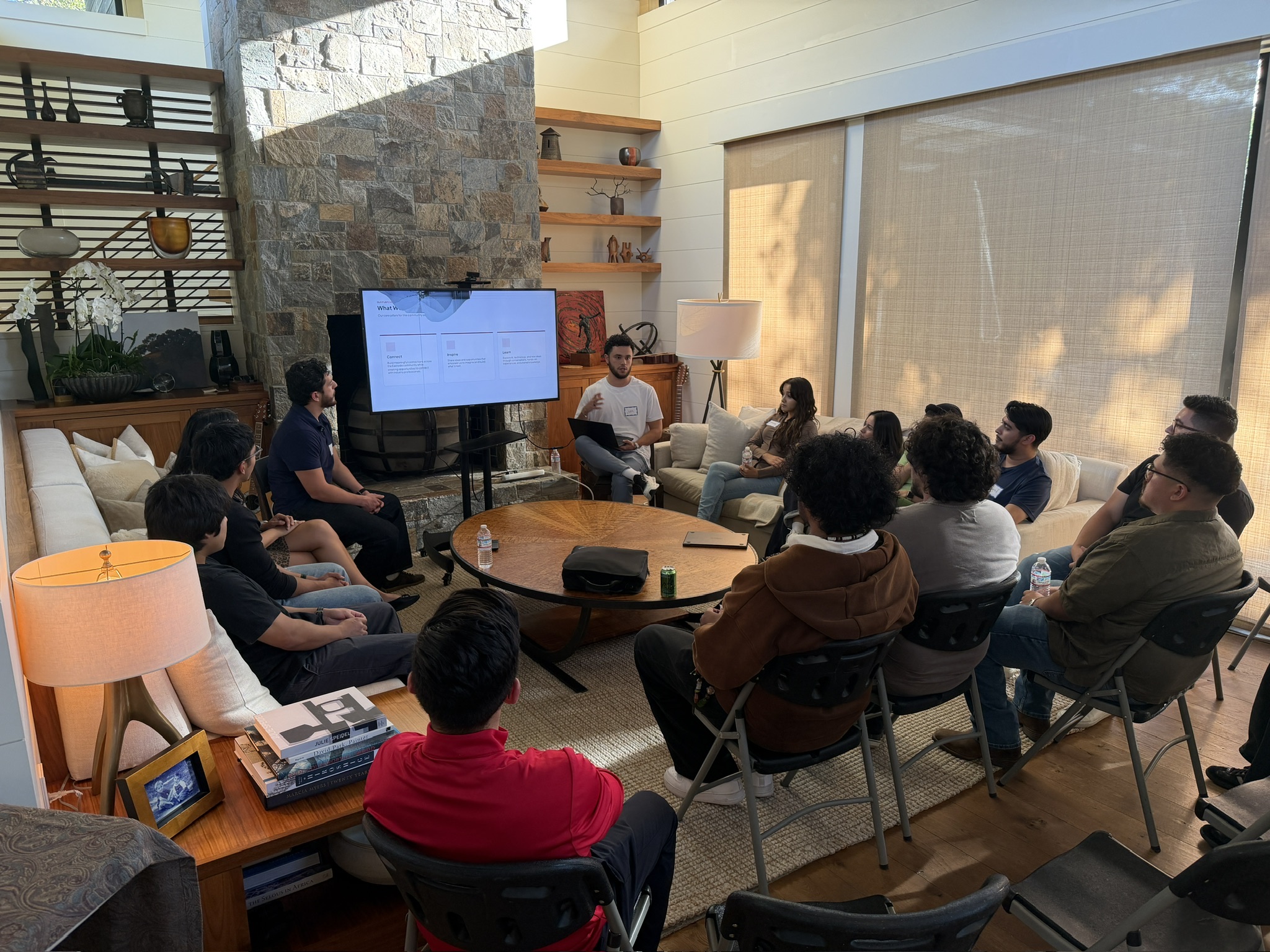 Eastside alumni seated together during an AI demonstration